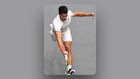 Spain's Carlos Alcaraz returns the ball to Canada’s Felix Auger-Aliassime during the group stage men’s singles match between Spain and Canada of the Davis Cup tennis tournament at the Fuente San Luis Sports Hall in Valencia Saturday. Alcaraz lost, 6-7, 6-4, 6-2. | Jose Jordan/agence france-presse