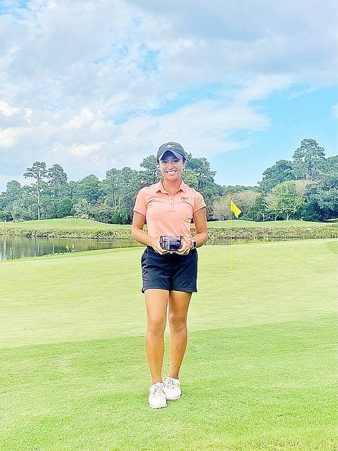 TOMI Arejola shows off the trophy after placing second in the Golfweek Fall Challenge in South Carolina. | Photograph courtesy
of Tomi Arejola