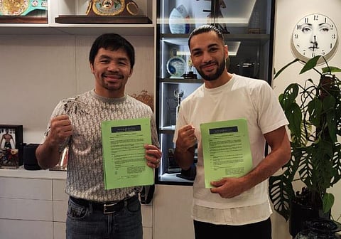 PHOTOGRAPH COURTESY OF Jaber Zayani
EIGHT-DIVISION world champion Manny Pacquiao (left) and unbeaten lightweight contender Jaber Zayani display their signed agreement finalizing their eight-round exhibition match in February in Riyadh, Saudi Arabia.