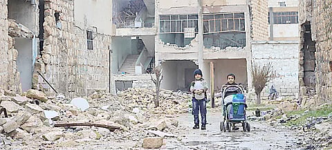 In east Aleppo in Syria, two boys collect water for their family. | Photograph courtesy of UNICEF