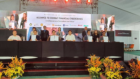 Bring it on Representatives of UnionBank, Globe Group, Smart and PLDT, and Converge witnessed the momentous signing of a data sharing memorandum of understanding. Left to right (seated): Bankers Association of the Philippines Ben Castillo, Smart Communications SVP and Head for Enterprise Joseph Ian Gendrano, Globe Group CISO Anton Bonifacio, UnionBank CTO Henry Aguda, UnionBank CISO Joey Rufo, and Converge CISO Benjamin Azada. | photograph courtesy of PSAC