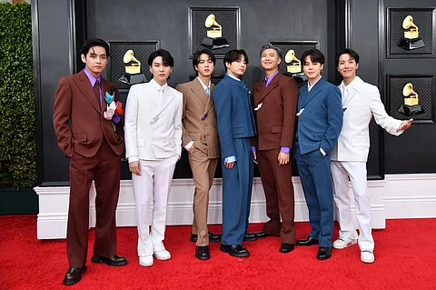 South Korean boy band BTS arrives for the 64th Annual Grammy Awards at the MGM Grand Garden Arena in Las Vegas. - K-pop supergroup BTS will enlist in the military, their agency said October 17, 2022, putting an end to a years-long debate on whether the stars deserved exemptions from mandatory service. Photo by ANGELA WEISS / AFP