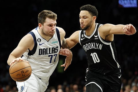 Luka Doncic of the Dallas Mavericks dribbles against Ben Simmons of the Brooklyn Nets during the second half at Barclays Center on October 27, 2022 in the Brooklyn borough of New York City. The Mavericks won 129-125. Photo by Sarah Stier / GETTY IMAGES NORTH AMERICA / Getty Images via AFP