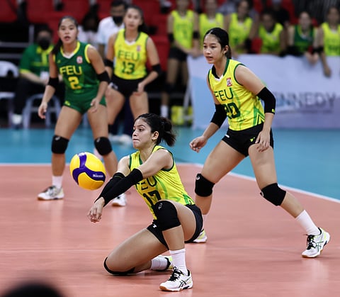 Far Eastern University’s Barbie Jamili (left) kneels to receive the ball against Letran during the Shakey’s Super League Collegiate Conference action at Rizal Memorial Coliseum Saturday. Photo by Rio Deluvio