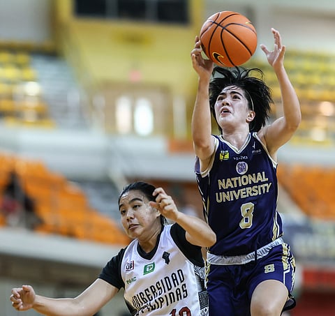 Angel Surafa and the NU Lady Bulldogs make history when they book their 100th consecutive win following a 79-44 win over the UP Fighting Maroons. Photo by Rio Deluvio