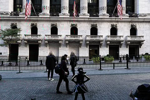 People walk outside The New York Stock Exchange in lower Manhattan in New York City. Chipmakers plunged in Asian trade Monday over new US measures to limit China’s access to high-end semiconductors with military uses, a move that wiped billions from companies’ valuations worldwide. | Spencer Platt/Agence France-Presse