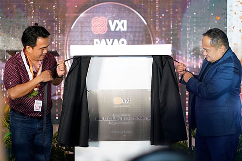 Davao City First District Councilor Bernie Al-ag (left) and VXI Senior Vice President and Country Manager Eppie Titong unveils the new site of VXI Global Solutions in Davao City