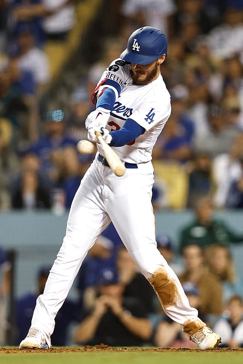 MICHAEL OWENS/Agence France-Presse
CODY Bellinger of the Los Angeles Dodgers hits a sacrifice fly ball during their game against the Colorado Rockies. The Dodgers prevailed, 6-4.