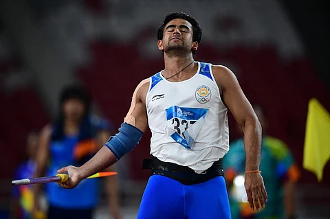 In this file photo taken on 27 August 2018, India's Shivpal Singh reacts in the final of the men's javelin throw athletics event during the 2018 Asian Games in Jakarta. Singh, who took part in last summer's Tokyo Olympics, has been suspended for four years after testing positive for a banned drug by the country's anti-doping disciplinary panel. (Photo by MARTIN BUREAU / AFP)