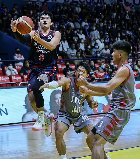 Kurt Reyson lends a helping hand to Letran’s 69-64 win over Lyceum in Season 98 NCAA men’s basketball tournament. | Photograph by Rio deluvio for the daily tribune