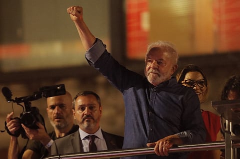Brazilian president-elect for the leftist Workers Party Luiz Inacio Lula da Silva greets supporters at the Paulista avenue after winning the presidential run-off election, in Sao Paulo, Brazil, on 30 October 2022. Lula was elected president Sunday by a hair's breadth, beating his far-right rival, reelectionist Jair Bolsonaro, in a down-to-the-wire poll that split the country in two, election officials said. (Photo by CAIO GUATELLI / AFP)