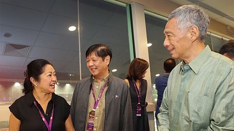 President Ferdinand Marcos Jr. (middle) and First Lady Liza Araneta-Marcos share a light moment with Singapore Prime Minister Lee Hsien Loong during the F1 Grand Prix in Singapore over the weekend. | PHOTOGRAPH COURTESY OF BBM FACEBOOK PAGE