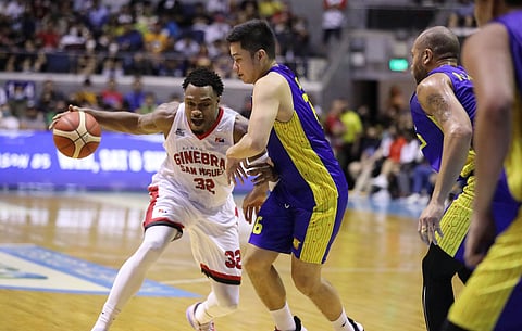 Barangay Ginebra import Justin Brownlee tries to extricate from the defense of the tight-guarding Roger Pogoy of TNT.