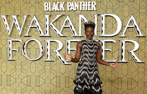 Mexico-born Kenyan actress Lupita Nyong'o poses on the red carpet on arrival to attend the European Premiere of "Black Panther: Wakanda Forever" in London, on 3 November. Photo by ISABEL INFANTES / AFP