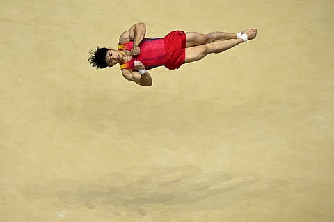 Carlos Yulo competes during the Men's Floor Exercise final at the World Gymnastics Championships in Liverpool, northern England on 5 November. Photo by Paul ELLIS / AFP
