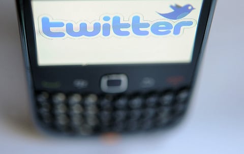 (FILES) In this file photo illustration taken on October 23, 2012, shows the screen of a Blackberry phone displays the Twitter in Quimperle, France. - Employee departures multiplied at Twitter on November 17, 2022, after an ultimatum from new owner Elon Musk, who demanded staff choose between being "extremely hardcore" and working long hours, or losing their jobs. "I may be #exceptional, but gosh darn it, I'm just not #hardcore," tweeted one former employee, Andrea Horst, whose LinkedIn profile still reads "Supply Chain & Capacity Management (Survivor) @Twitter." (Photo by FRED TANNEAU / AFP)