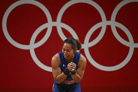 Hidilyn Diaz puts premium on her quest to make the Paris Olympics instead of going for a sure gold in the Phnom Penh Southeast Asian Games. Photo by Vincenzo PINTO / AFP