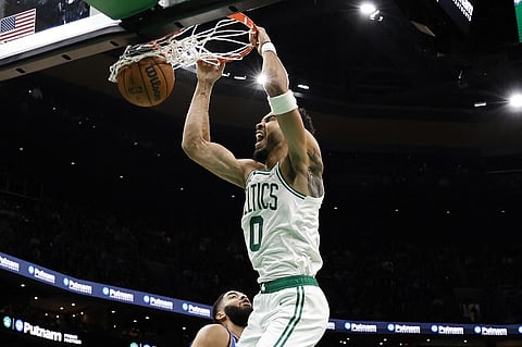 Jayson Tatum of the Boston Celtics dunks over Kenrich Williams #34 of the Oklahoma City Thunder during the second half at TD Garden on 14 November in Boston, Massachusetts. Photo by Winslow Townson / GETTY IMAGES NORTH AMERICA / Getty Images via AFP