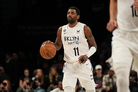 Kyrie Irving of the Brooklyn Nets dribbles the ball during the game against the Memphis Grizzlies on November 20, 2022 at Barclays Center in Brooklyn, New York. Photo by Jesse D. Garrabrant / NBAE / Getty Images / Getty Images via AFP