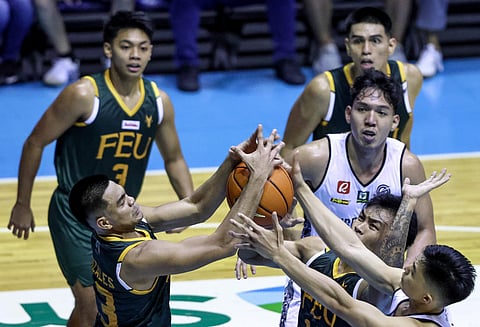 FEU and UP players battle for a rebound. Photo by Rio Deluvio