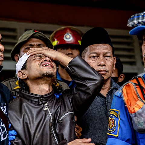 AHMAD Ashikin, father of seven-year-old Indonesian girl Ashika Nur Fauziah, is grief-stricken after rescuers found her dead under the rubble at Cugenang village, in Cianjur, Indonesia. | MAS AGUNG WILIS/AGENCE FRANCE-PRESSE