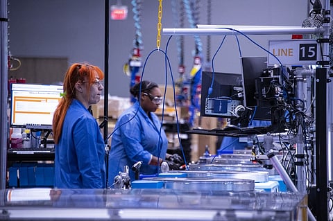 Employees build and test robots at Amazon's BOS27 Robotics Innovation Hub in Westborough, Massachusetts on November 10, 2022. The robotics laboratory of the US e-commerce giant is developing the automation of its distribution centers around the world so that customers receive their orders efficiently in the shortest possible time. (Photo by JOSEPH PREZIOSO / AFP)