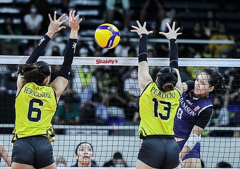 Adamson's Antonette Adolfo scores against UST's Jonn Perdido (13) and Imee Hernandez during the Shakey's Super League bronze match at the Rizal Memorial Coliseum, November 19, 2022. Photo by Rio Deluvio