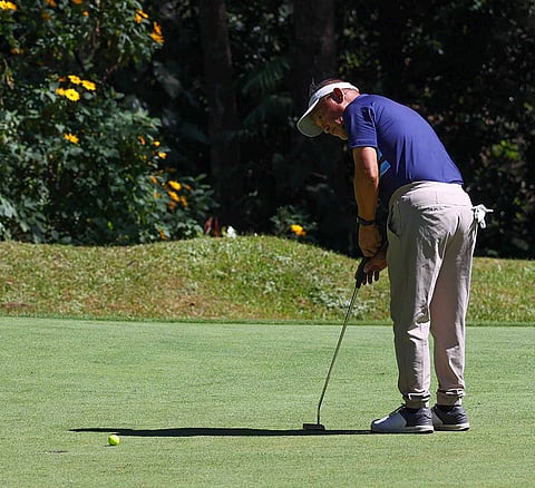 Photographs by RIO DELUVIO for the Daily Tribune @tribunephl_rio
BENJIE Sumulong of Luisita Golf Club putts on the ninth green at the Camp John Hay Golf Club in Baguio City during the second day of the 72nd Fil-Am Men’s Invitational golf team championships.