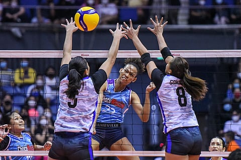 PHOTOGRAPH COURTESY OF PVL
CHERRY Nunag of Choco Mucho attacks the defense of Mary Jean Pabayo and Jovelyn Gonzaga of UA Army during their PVL Reinforced Conference game yesterday. The Flying Titans won, 26-24, 25-10, 25-17.