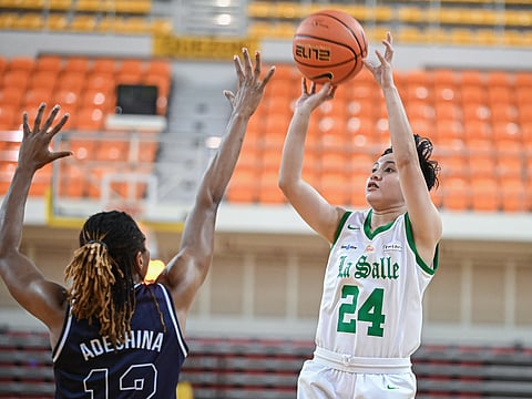 La Salle's Charmaine Torres shoots over Adamson's Victoria Adeshina during the their UAAP Season 85 women's basketball tournament.