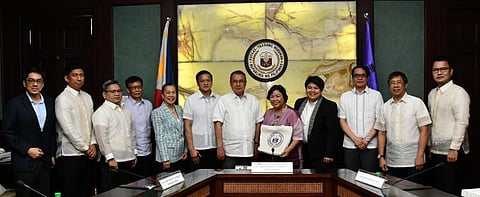 PHOTOGRAPH COURTESY OF SC
Chief Justice Alexander Gesmundo and Department of Migrant Workers Secretary Toots Ople (center) in a meeting at the Supreme Court last 7 November 2022 to discuss ambulance chasing involving lawyers.