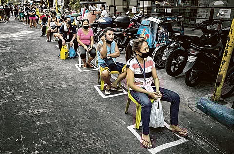 PHOTOGRAPH COURTESY OF BLOOMBERG
LOCAL governments stepped up to deliver basic needs like food and (inset) vaccine shots to their constituents.