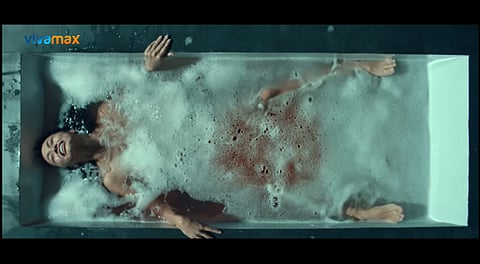 KYLIE Versoza as Daisy in 'The Housemaid.' Photo shows her dipped in blood-stained water in a scene from the movie. | PHOTOGRAPH COURTESY OF VIVAMAX