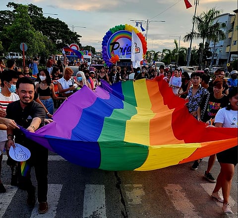 Photographs by Roel Hoang Manipon for the daily tribune
A giant rainbow flag at the Pride march on 6 November.