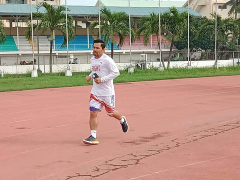 Manny Pacquiao shows up for morning roadwork with astonishing regularity in General Santos City. / Jonathan PeÑalosa