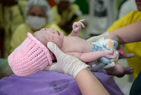 The Philippines holds out among a decreasing number of countries that still considers abortion a crime. One in three newborns in the Philippines is unwanted or unplanned, a government study revealed. The population officially reached 100 million on 27 July 2014 with the birth of the baby above. | TED ALJIBE/AGENCE FRANCE-PRESSE