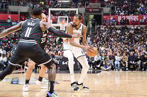 LOS ANGELES, CA - NOVEMBER 12: Kevin Durant #7 of the Brooklyn Nets looks to pass the ball during the game against the LA Clippers on November 12, 2022 at Crypto.com Arena in Los Angeles, California. NOTE TO USER: User expressly acknowledges and agrees that, by downloading and/or using this Photograph, user is consenting to the terms and conditions of the Getty Images License Agreement. Mandatory Copyright Notice: Copyright 2022 NBAE Adam Pantozzi/NBAE via Getty Images/AFP (Photo by Adam Pantozzi / NBAE / Getty Images / Getty Images via AFP)