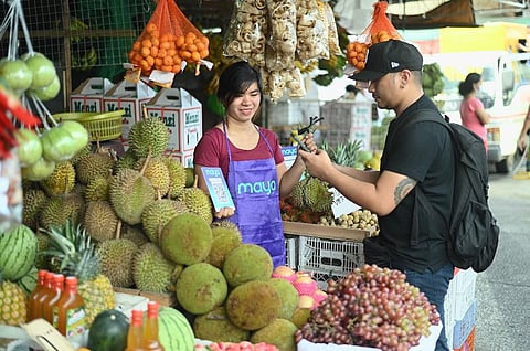 With the Paleng-QR program supported by Maya in Davao city, vendors and tricycle drivers in the Bankerohan Public Market can now accept digital payments from customers regardless of their e-wallet or bank accounts. | photograph courtesy of Maya