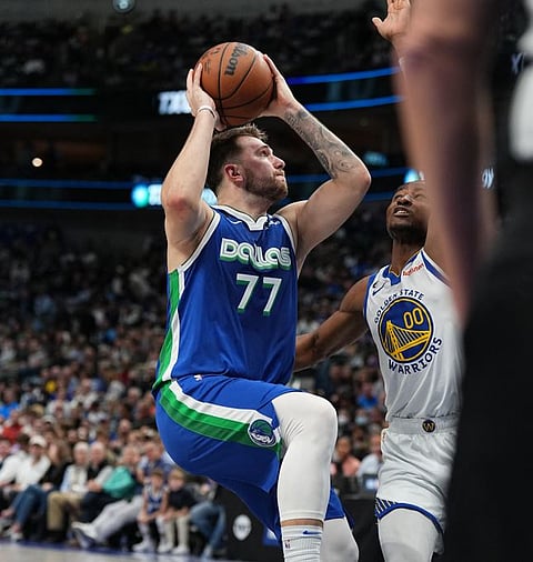 GLENN JAMES/AGENCE
FRANCE-PRESSE
LUKA Doncic drops a triple-double to power the Dallas Mavericks to a 116-113 win over the Golden State Warriors.