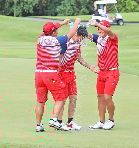 Japanese Yuta Sugiura, Minato Oshima and Riura Matsui celebrate after regaining the Nomura Cup at the Masters course of the Manila Southwoods Golf and Country Club in Carmona, Cavite Friday. | Photograph by joey sanchez mendoza for the daily tribune @tribunephl_joey