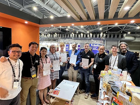 Officials of UBX and ThitsaWorks express delight after sealing a partnership that would usher digital infrastructure for international remittances between Singapore and the Philippines, benefitting overseas Filipino workers in Singapore. | Photograph courtesy of ubx