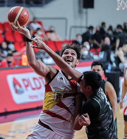 Terrafirma’s Aldrech Ramos fails to stop an overpowering June Mar Fajardo of San Miguel Beer in this bit of action in the Philippine Basketball Association Commissioner’s Cup Wednesday at the Philsports Arena. Photo by Rio Deluvio