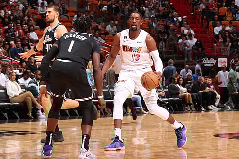 Bam Adebayo of the Miami Heat dribbles the ball during the game against the LA Clippers. Photo by Issac Baldizon / NBAE / Getty Images / Getty Images via AFP