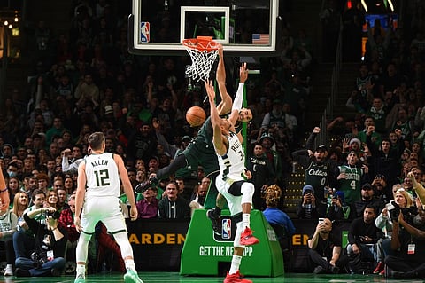 Jayson Tatum of the Boston Celtics dunks the ball during the game against the Milwaukee Bucks on December 25, 2022 at the TD Garden in Boston, Massachusetts. Photo by Brian Babineau / NBAE / Getty Images / Getty Images via AFP