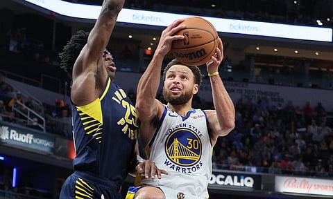 Stephen Curry of the Golden State Warriors against the Indiana Pacers. Photo by ANDY LYONS / GETTY IMAGES NORTH AMERICA / Getty Images via AFP