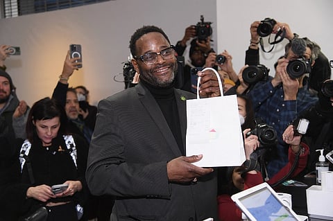One of the first customers to make a purchase, Daron Hudson attends the opening of Housing Works Cannabis Co, the first recreational cannabis dispensary in New York on 29 December 29 in New York City. Photo by Gary Gershoff / GETTY IMAGES NORTH AMERICA / Getty Images via AFP