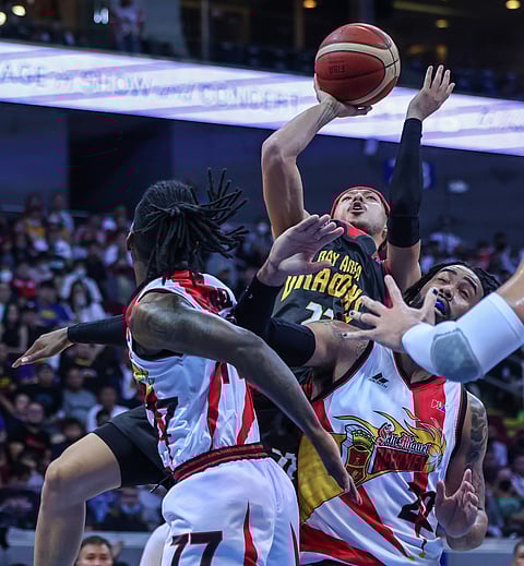 Kobey Lam penetrates the defense of San Miguel's CJ Perez and Devon Scott in the PBA Commissioner's Cup semifinals game 4 at the Mall of Asia Arena in Pasay, on 21 December. Photo by Rio Deluvio