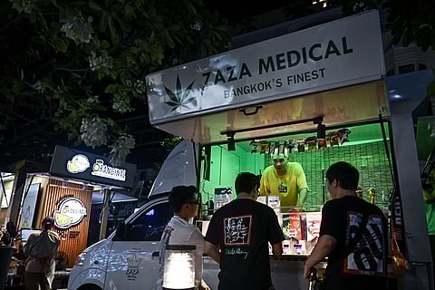 In Bangkok's posh Thonglor district, Zaza Medical truck vendors nervously wait for clarity on their legal status. "Hopefully we can keep selling," said part-owner and rapper Guygeegee. (LILLIAN SUWANRUMPHA / AFP)