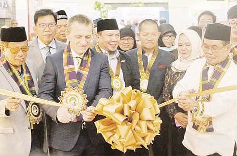 Ministry of Basic, Higher, and Technical Education Chief Mohager Iqbal (front, left), with MBHTE Deputy Minister Haron Meling (front, right) and UNICEF Mindanao Field Office Chief Radoslaw Rzehak (front, second from right), opening the first-ever BARMM Education Summit at the SMX Convention Center, SM Lanang. | PHOTOGRAPH COURTESY OF BARMM