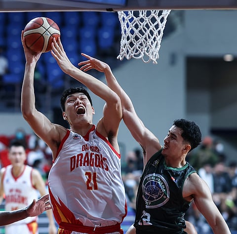 Liu Chuanxing of Bay Area gets to test his prowess against June Mar Fajardo of San Miguel in their PBA Commissioner’s Cup best-of-five semifinal series. Photo by Rio Deluvio